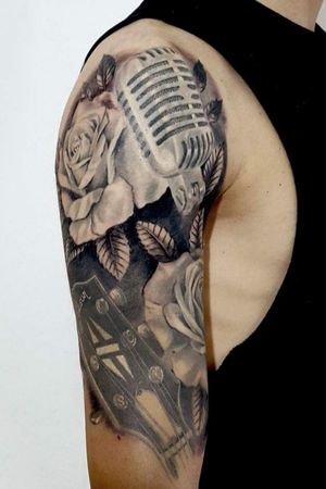 My music tattoo🎶🎸 #musictattoo  #rose #roses #sleeve #tattoo #guitar #gibson #mytattoo #tattooart #mic #blackandgreytattoo 