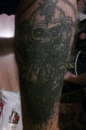 Zombie Gore pile cover up tattoo also a huge black blob. This one is on my leg though lol.