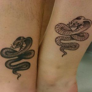 Matching snake ankle tattoos