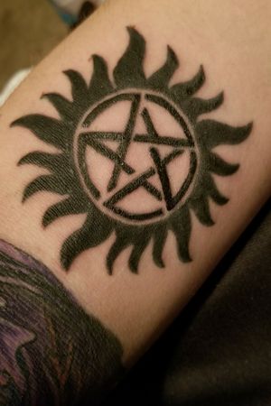 This is from the show "Supernatural", it's a symbol to prevent demons from possessing  the individual who has this 