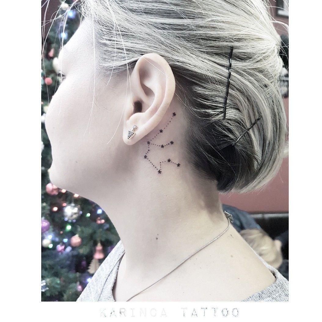 Minimalistic style tiny Aquarius constellation tattoo