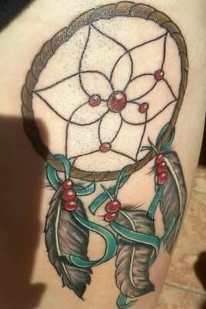 Dream catcher on right thigh