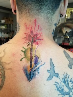 arrow with colorsplash tattoo 