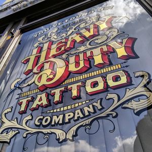 Hand painted and gold leaf window sign for Heavy duty tattoo, Darlington. #tattooshop #tattooart #signwriter #goldleaf
