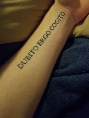 Left arm. "Dubito Ergo Cogito"- I Doubt Therefore I Think