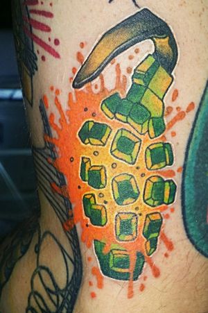 Colorful exploding Grenade tattoo by Bailie Waters 