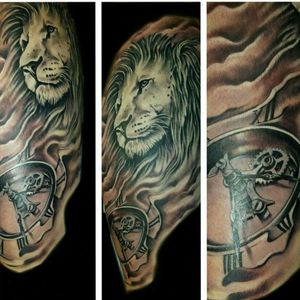 Lion and clock thigh tattoo #lion #clock #blackandgrey 