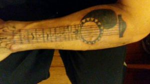 Guitar on left forarm, needs touched up tho