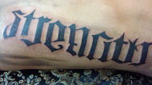  it's a ambigram. It says strength and courage