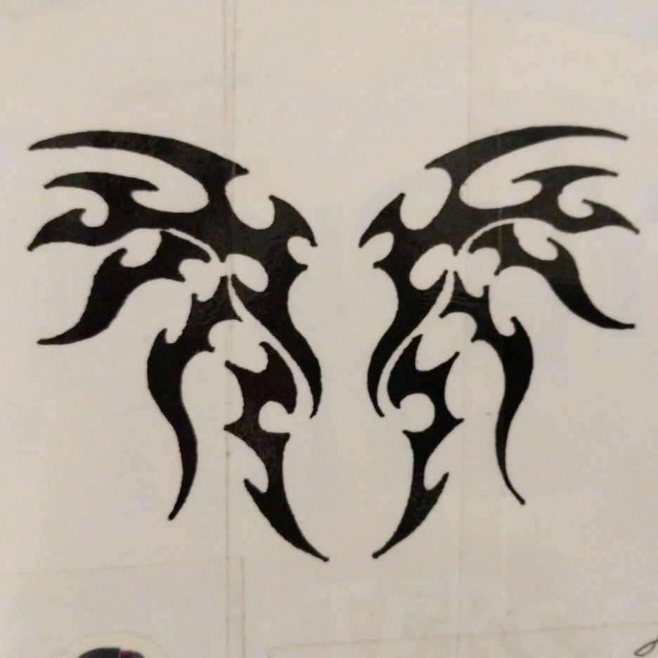 tribal demon wings tattoos