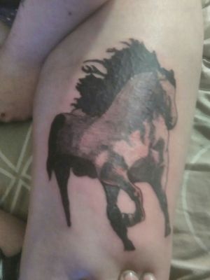 Thigh horse tattoo