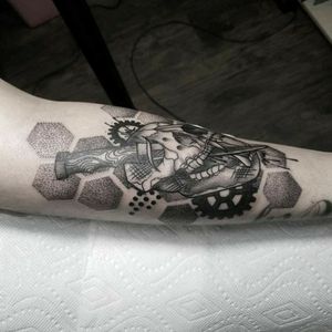 Bear skull with a dagger dot work and geometric designs as well as some splatter..