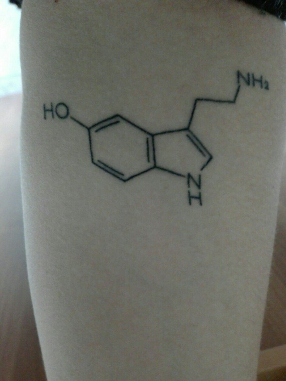 Dopamine chemical structure tattoo located on the foot