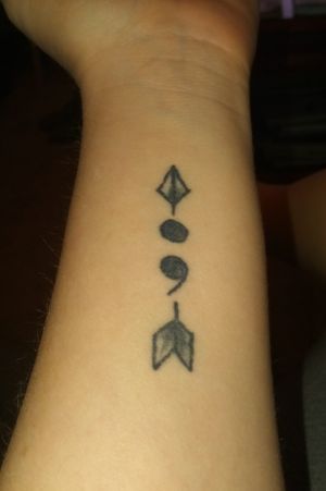 Semicolon tattoo and arrow 