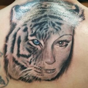 Tiger face morph. Realistic cover up tattoo