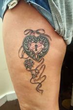 Heart-shaped locket and key #locket #key #womenwithtattoos #tattooedwomen 