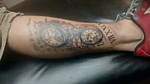Leg tattoo. Clocks