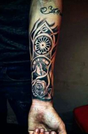 Arm tattoo. Clock. Rose