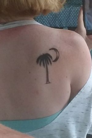 Palm tree and crescent moon by Dema Denisevich at Ink Slingers in Springfield, Mo
