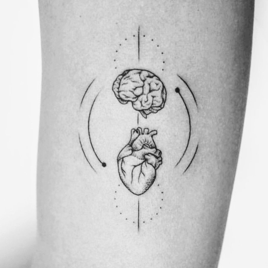 FIne line brain vs heart tattoo on the inner arm