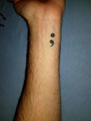 My first tattoo, a Semikolon.