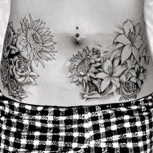 Unfinished, Roses, Sunflowers and Lilies added to two existing roses on my hips over 10 years ago. 