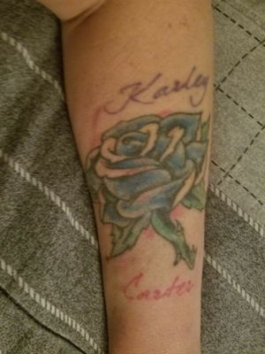 Cover up of my very first tattoo. This was the first one i had done with my youngest two kids names. 