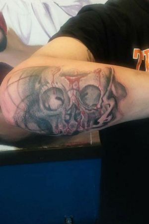 Skull w/dripping blood spots on outter forearm