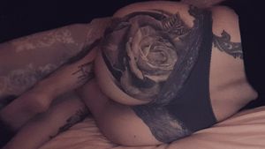 Butt rose tattoo by Michael Mahon in Spain  