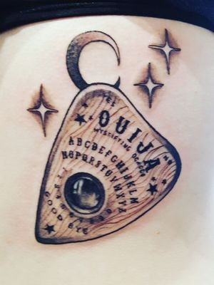 Ouija board planchette on my rib 😊 #ribtattoo #ouijatattoo #planchette #blackandgrey #leftrib #ouch #loveit #alternativegirl #tattooedgirl #piercedgirl #stretchedears 