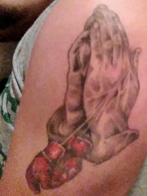 My first tat. Boxing gloves with prayer hands