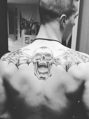 My very first tattoo #blackandgrey #avengedsevenfold #upperback #skull #wings #a7x #upperback #shoulder 