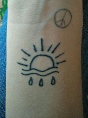 The sun rises through the rain #smalltattoo #tattootherapy #smallsun #lines #blackink 