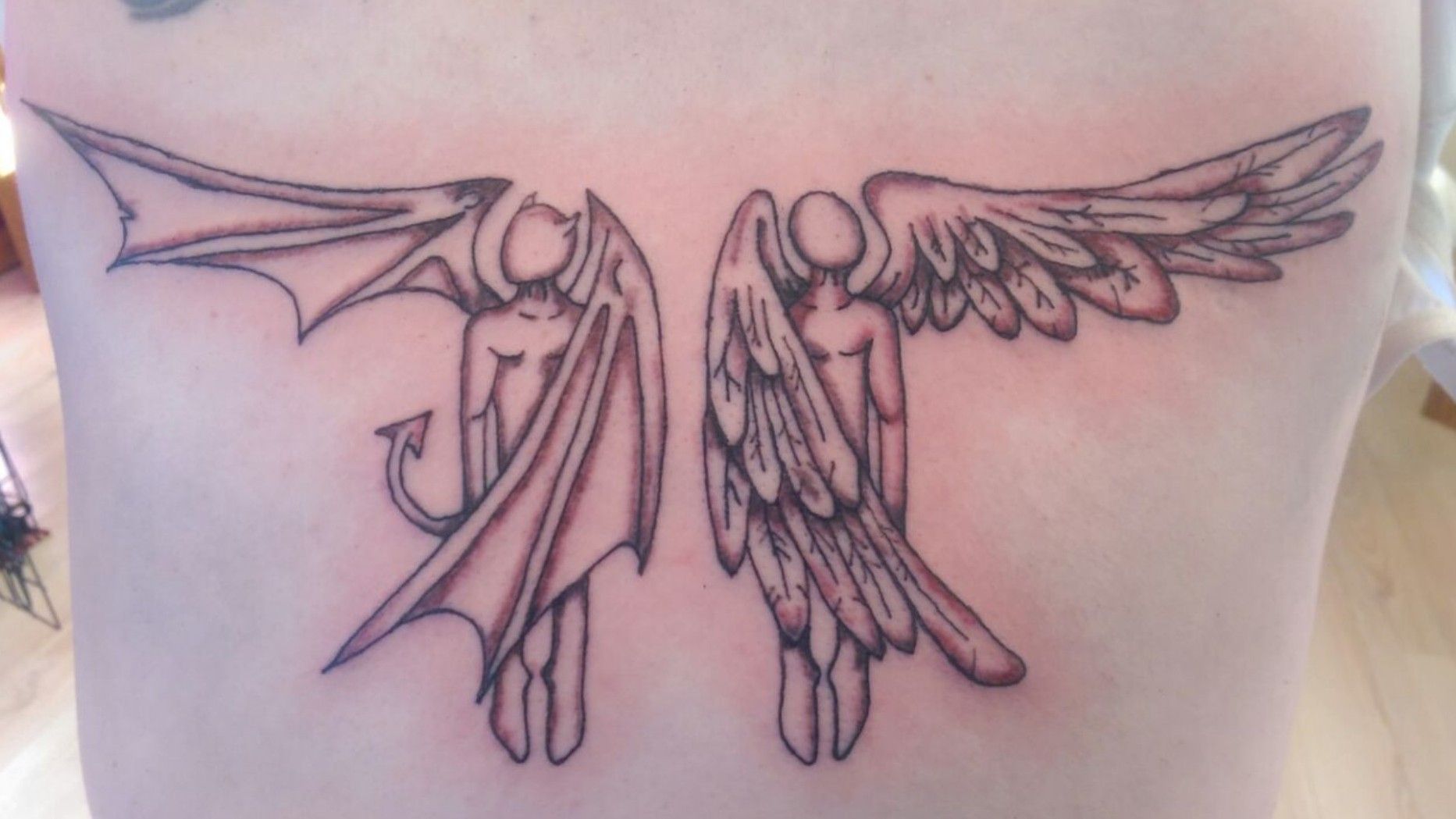 Tattoo uploaded by Conceptual ink Kingston • Angel and devil wings
