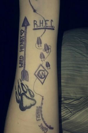 My first tattoo. I got bored one night decided to draw random stuff on my arm and came up with this.