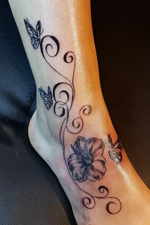 #tattoo #blacktattoo #hibiscus #hibiscustattoo #flowertattoo #butterflytattoo #inked #ink #tattoed #inkedgirls #legtattoo