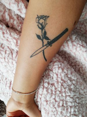 Knife and rose tattoo