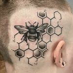 Black, White, & Grey bee with hexagonal honeycomb pattern by Sarah Giacalone at Electric Chair Tattoo in Flint, MI