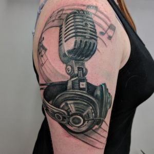 New tattoo, more to come! #music #musictattoo #microphone #headphones #musicnotes 
