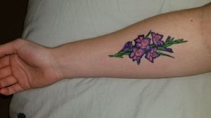 Most recent tattoo. Traditionally styled gladiolus flowers