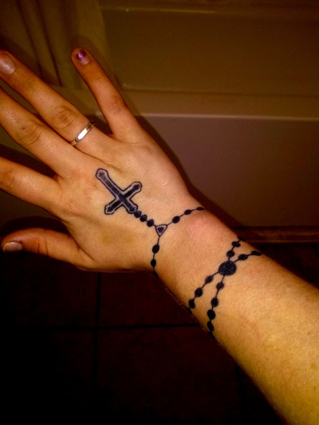 Had a blast with these rosary beads and crucifix tattooed tattooparlor  tattoolover tattoolife inked   Wrist tattoos for women Rosary tattoo  Finger tattoos