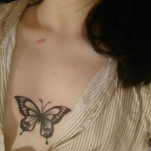 female chest butterfly tattoo