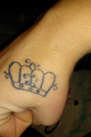 This is my Queen's crown on my right hand. My boyfriend has a King's crown on his right hand. The unique thing about them is that my boyfriend drew and designed ours himself. 