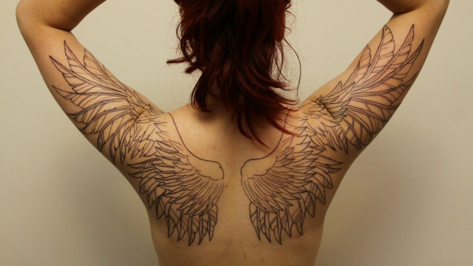 anatomically correct wing tattoo