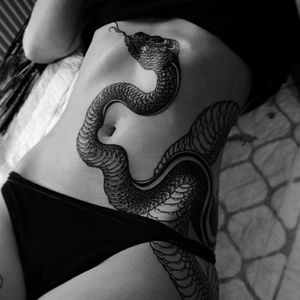 I love how the snake matches this body. Seems almost alive....#snake #snaketattoo #realistic #beautifultattoo 