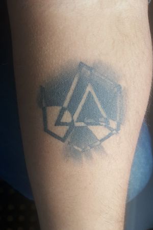 Linkin Park logo with A Thousand Suns album cover inverted in the background
