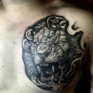 chest. lion. BnG tattoo