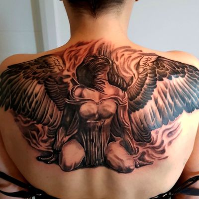 angel face with wings tattoo