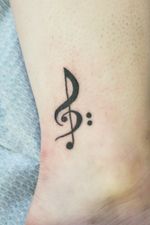 First tattoo right on the ankle. Treble cleff with bass clef incorporated into it