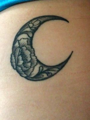 This crescent moon is filled with beautiful flowers, and is on my ribs on the left side (It looks a little crooked, because I took this picture myself). The moon is about 3 inches in diameter!